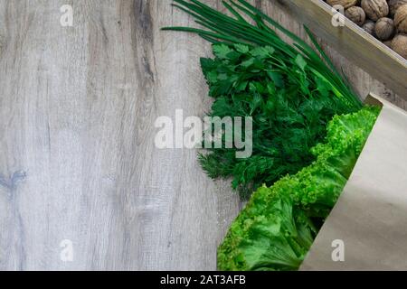 Background of Various Fresh Greens with Lettuce, Basil, nuts, Dill and Parsley Stock Photo