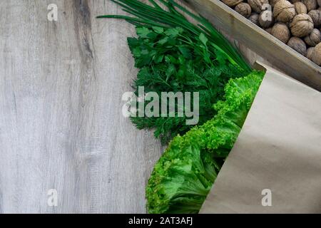 Background of Various Fresh Greens with Lettuce, Basil, nuts, Dill and Parsley Stock Photo