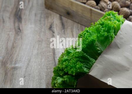 Background of Various Fresh Greens with Lettuce, Basil, nuts, Dill and Parsley Stock Photo