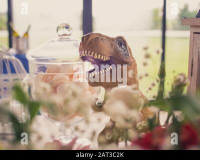 Selective focus shot of a brown plastic dinosaur toy Stock Photo