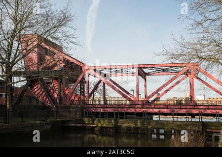 The Surrey Basin Bascule Bridge with Surrey Basin Lock in the foreground, on Rotherhithe Street, London,UK. Stock Photo