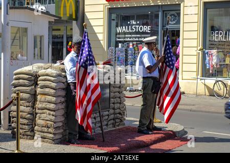 Berlin, Berlin state / Germany - 2018/07/30: Contemporary memorial of Checkpoint Charlie, known also as Checkpoint C - Berlin Wall historic crossing point between East Berlin and West Berlin in Cold War time Stock Photo