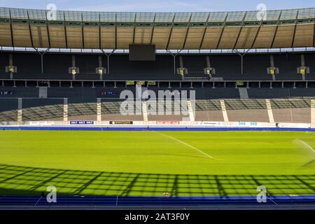 Berlin, Berlin state / Germany - 2018/07/31: Inner space of the historic Olympiastadion sports stadium originally constructed for the Summer Olympic in 1936 Stock Photo