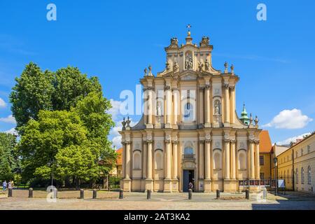 Warsaw, Mazovia / Poland - 2019/06/01: Front view of the rococo Visitationist St. Joseph Church �â�� known as Kosciol Wizytek - at the Krakowskie Przedmiescie street in the Old Town quarter of Warsaw Stock Photo