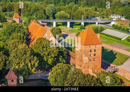 Malbork, Pomerania / Poland - 2019/08/24: Aerial panoramic view of the external defense walls, towers moat and keeps of the medieval Teutonic Order Castle in Malbork, Poland Stock Photo