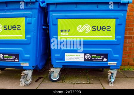 Do not climb into this container; Suez new commercial wheelie bins, general waste retail store collections & disposal. Stock Photo