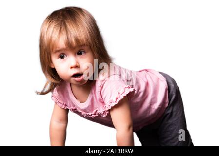 2 year old child on all four isolated on white background. Cutout photo for concept of development. Stock Photo