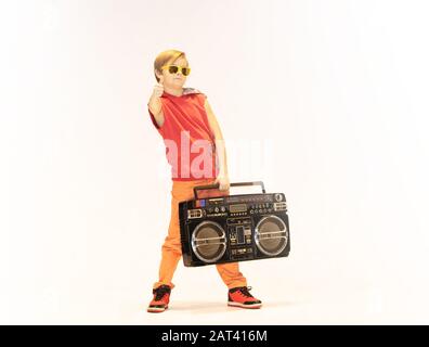 little boy with a big boombox, unique kid, hip hop style Stock Photo