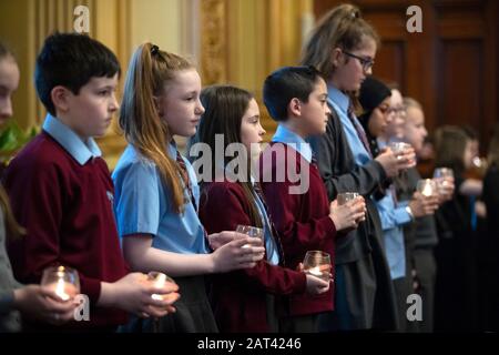 Year 7 students from St Timothy's Primary School during the 'Stand Together' Glasgow Schools' Holocaust Memorial event at Glasgow City Chambers, Glasgow. PA Photo. Picture date: Thursday January 30, 2020. Pupils from schools across Scotland gathered to remember the liberation of Auschwitz 75 years on and the genocide in Bosnia 25 years ago. Photo credit should read: Jane Barlow/PA Wire Stock Photo