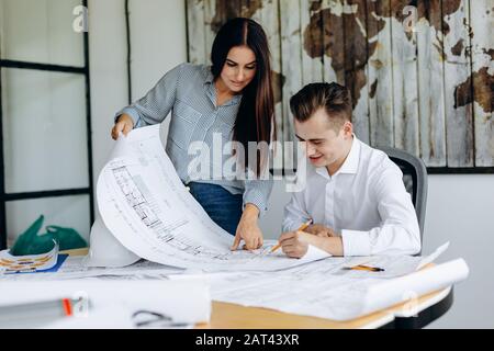 Two professional architects are working on the drawing Stock Photo
