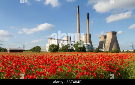Ferrybridge Power station in England.With a red poppy field in foreground. Stock Photo