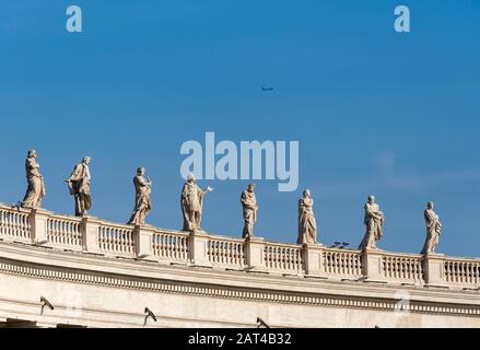 Statues of saints on Bernini colonnades, St. Peter's Square, Vatican, Rome, Italy Stock Photo