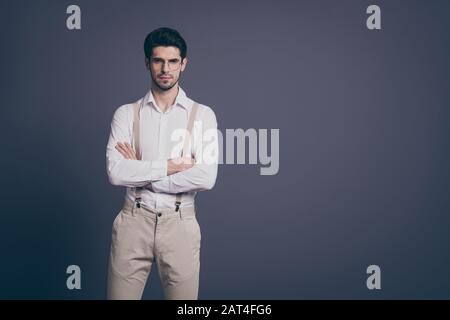 Portrait of his he nice attractive trendy imposing elegant luxurious serious focused brunette man experienced expert specialist folded arms isolated Stock Photo
