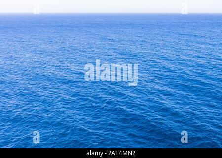 Classic blue sea with a perspective into the distance horizon Stock Photo