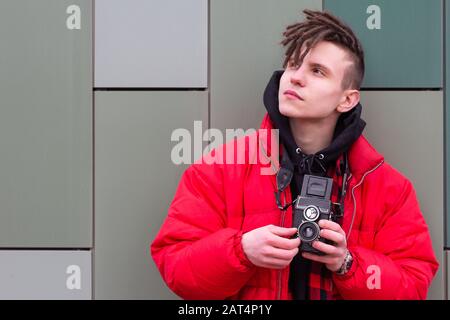 portrait of photographer took shot and looking to the side fashionable Stock Photo