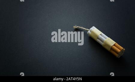 Dynamite TNT bomb made from cigarettes a quit smoking concept bad habit addiction Stock Photo