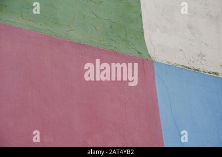 Painted wall of four colors, green, cream, red and blue, in Caminito, La Boca, Buenos Aires, Argentina Stock Photo