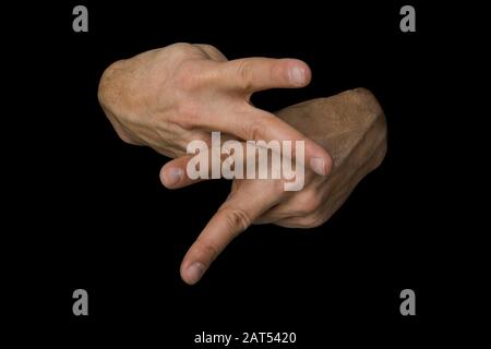 The word CARE in British sign language on an isolated black background Stock Photo