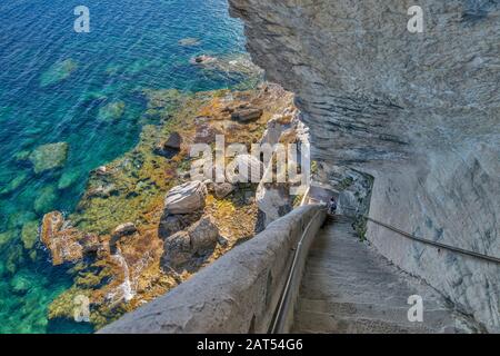 Escalier du roi d'Aragon (King Aragon Steps) cut in 1420 in limestone cliff over Strait of Bonifacio in Bonifacio, Corse-du-Sud, Corsica, France Stock Photo