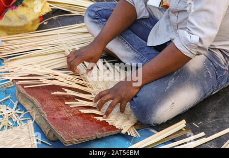 Local craftsman working on the creation of handicraft items for sale at a craft fare at Kolkata, India Stock Photo