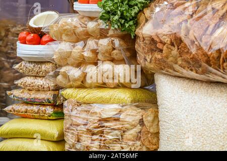 Popular tasty Indian street food ingredients of puffed rice with chips, tomatoes and other fries, commonly known to prepare pani poori and bhelpuri Stock Photo
