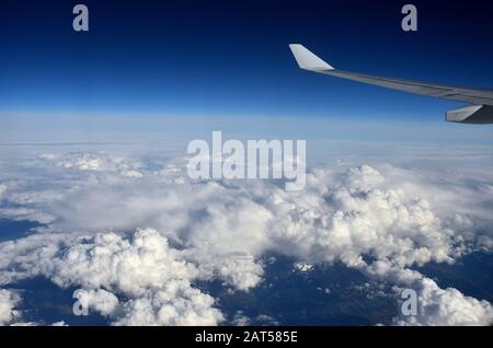 Flying on the clouds in a blue sky is always an unforgettable experience Stock Photo