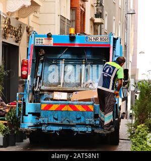 ISTANBUL, TURKEY - Sep 16, 2019: A garbage collection truck and bin man keeping the streets clean. Waste management concept image. Stock Photo