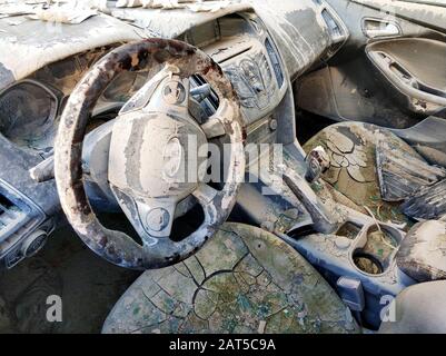 Dirty transport motorized vehicle damaged car interior after flood or heavy rain Stock Photo