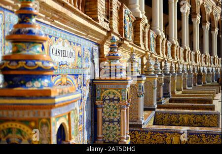 Along wall 48 alcoves with designed on colourful azulejos painted ceramic tiles benches one for each province of Spain, closeup, Plaza de Espana Spain