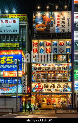 A seafood restaurant in Akihabara district at night. Tokyo, Japan, August 13, 2019 Stock Photo