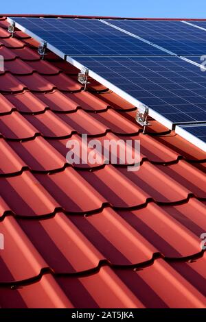 photovoltaic panels on the roof of a single-family house in the countryside Stock Photo