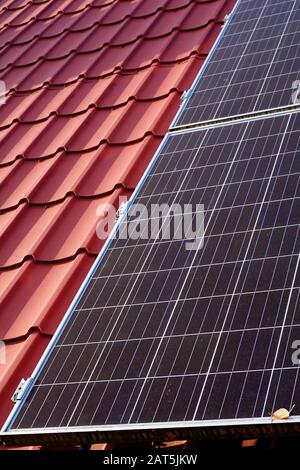 photovoltaic panels on the roof of a single-family house in the countryside Stock Photo