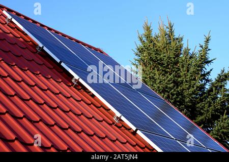 photovoltaic panels on the roof of a single-family house in the countryside Stock Photo
