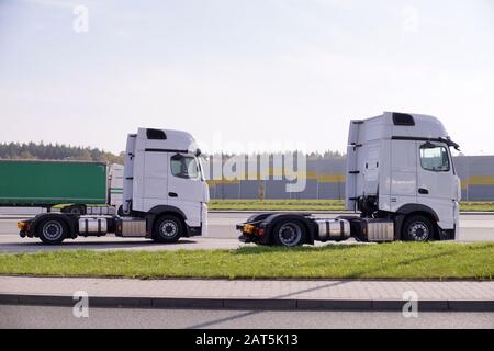 Travel break. New trucks on the way to the customer. Stock Photo