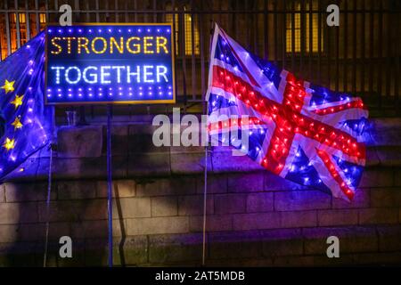 Westminster, London, 30th Jan 2020. Pro European protesters continue to rally outside Parliament with a Stop Brexit night vigil, including illuminated flags, placards and a sound system. Credit: Imageplotter/Alamy Live News Stock Photo