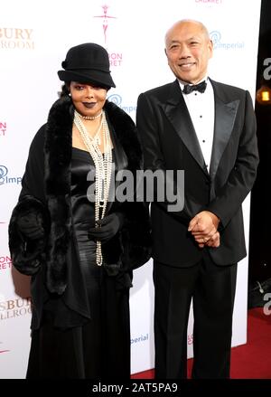 Janet Jackson (left) and Professor Tiong Ghee Teoh arrives at the Gatsby Gala, in aid of Prematurity Research, at the Bloomsbury Ballroom, London. Stock Photo