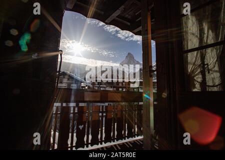 view of Matterhorn through hotel window in Zermatt Stock Photo