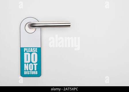 please do no disturb sign on handle on white background Stock Photo