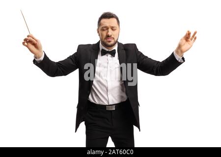 Young male conductor with closed eyes conduction with baton isolated on white background Stock Photo
