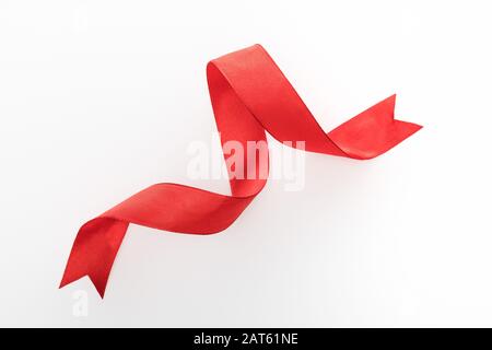 top view of red decorative curved ribbon isolated on white Stock Photo