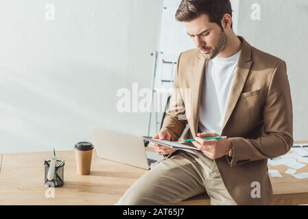 Selective focus of designer developing user experience design in designer studio Stock Photo