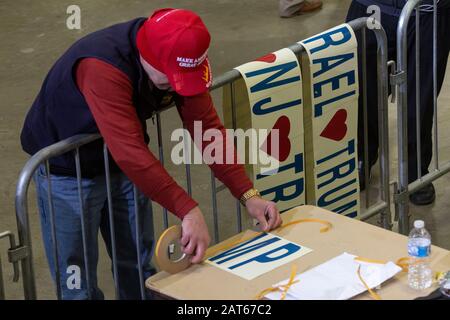 Man prepares handmade banner/sign at the 'Keep America Great' rally held at the Wildwoods Convention Center. Stock Photo