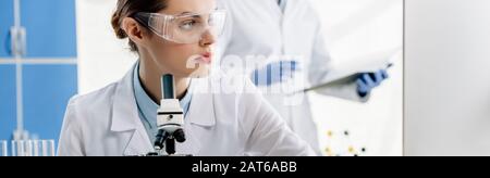 panoramic shot of molecular nutritionist in goggles looking away Stock Photo