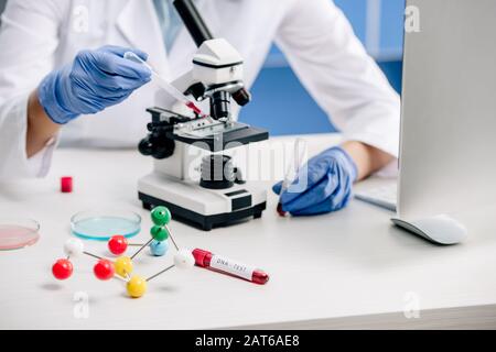 cropped view of genetic consultant doing dna test in lab Stock Photo