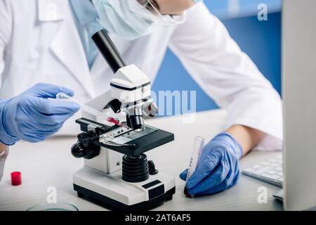 cropped view of genetic consultant doing dna test in lab Stock Photo