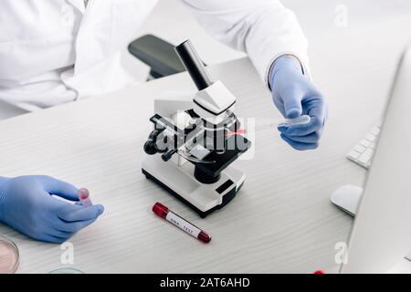 cropped view of genetic consultant doing dna test in lab Stock Photo