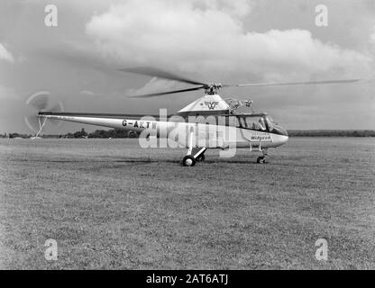 A vintage black and white photograph, taken in the 1950s, showing a Westland Widgeon Helicopter, registration G-AKTW. Preparing to take off.