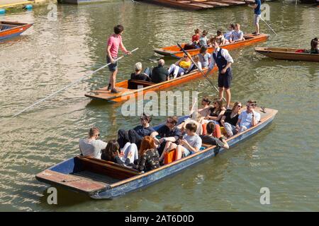 Tourists on punts on the River Cam in Cambridge, United Kingdom