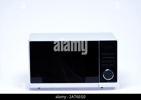 metal and electrical microwave oven on white background Stock Photo