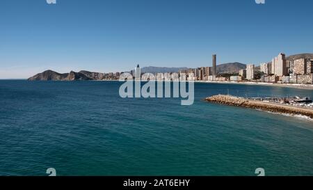 Playa de Poniente beach with skyscrapers Intempo and Gran Hotel Bali and breakwater in the foreground (Benidorm, Costa Blanca, Alicante, Spain) Stock Photo